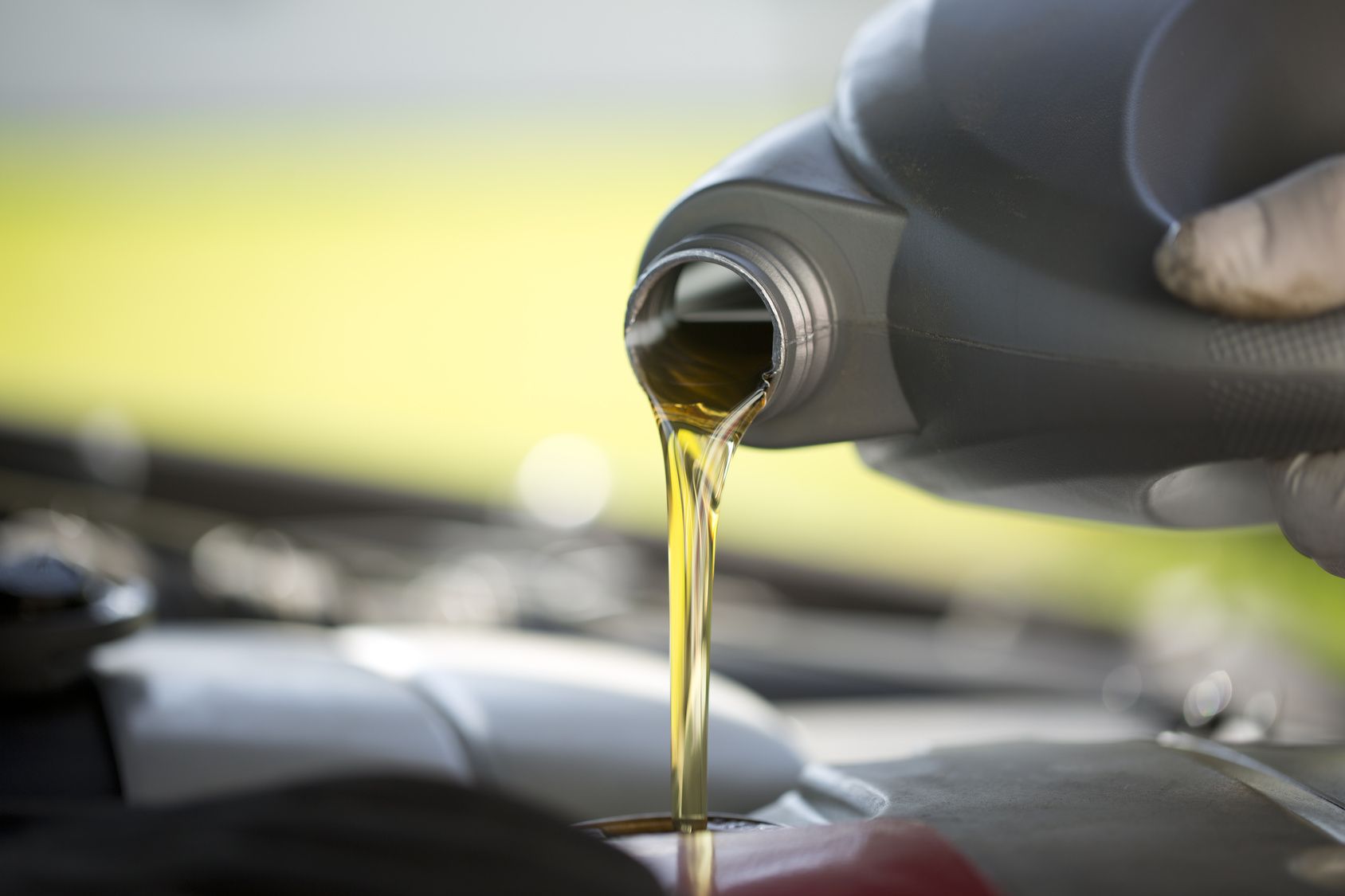 Lubricating base oil being poured