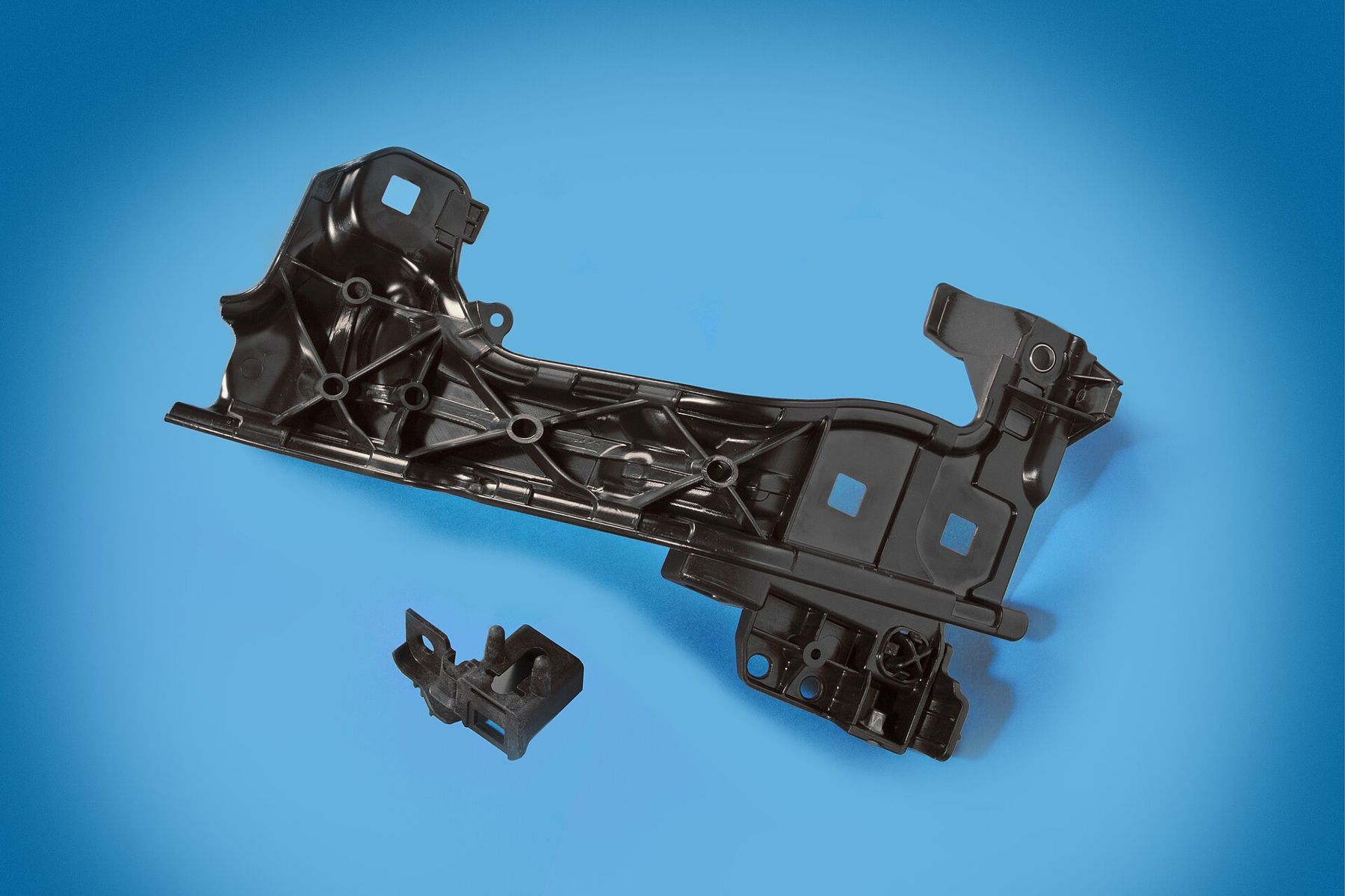 Injection-moulded engineering compound bracket
